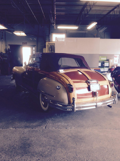 A classic wood-paneled convertible in for service at Masello's Auto Service